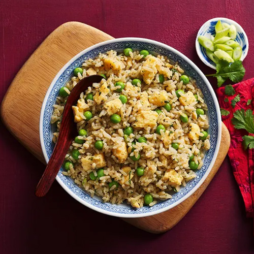 Slimming World food range Chinese-style rice in a light blue bowl on a purple table