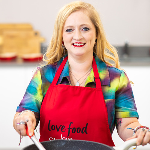 Slimming World's Free Food Festival winner Maria Russo cooking her winning dish in a frying pan